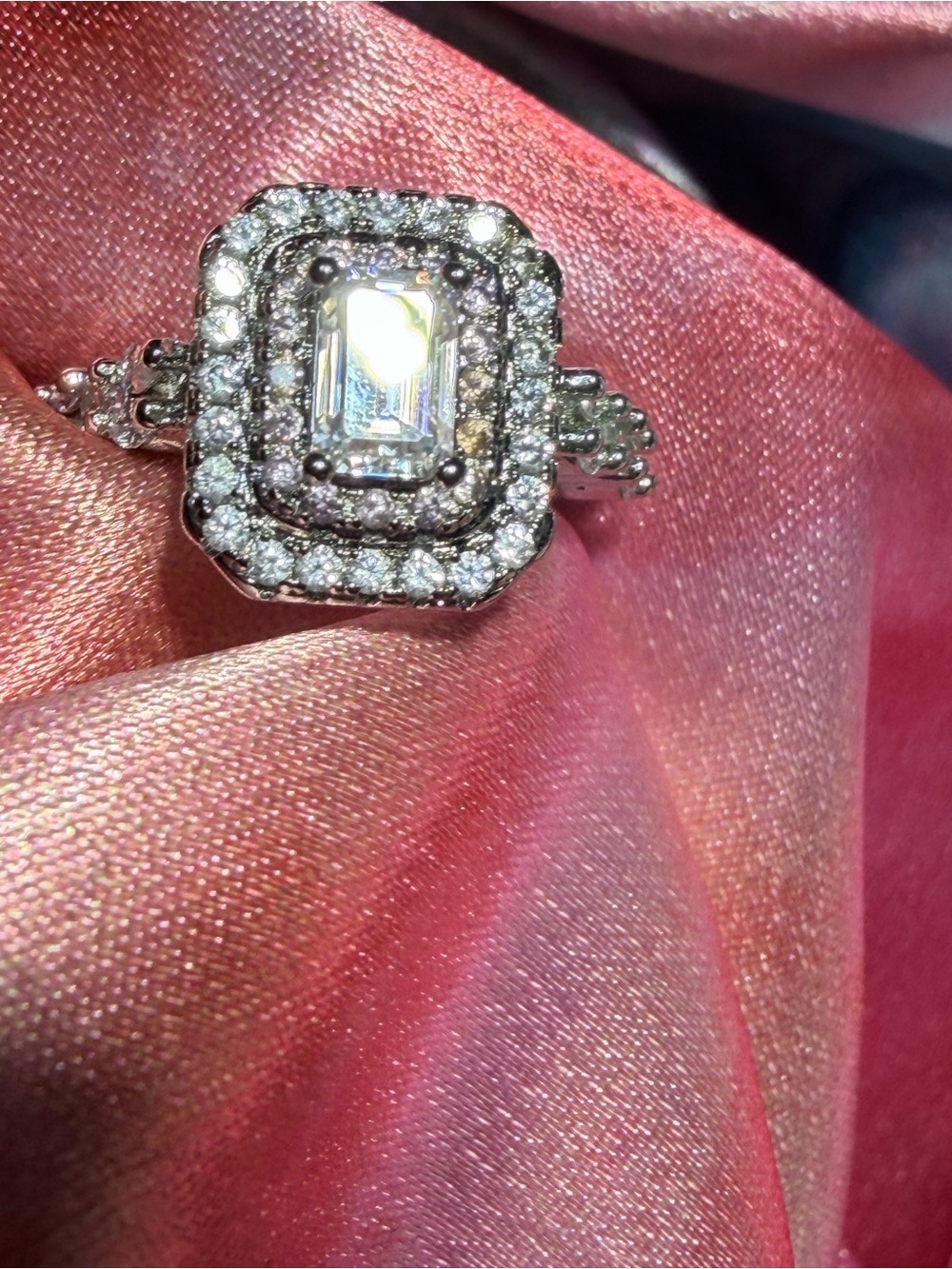 New Emerald Moissanite Ring with tapered baguette side stones.